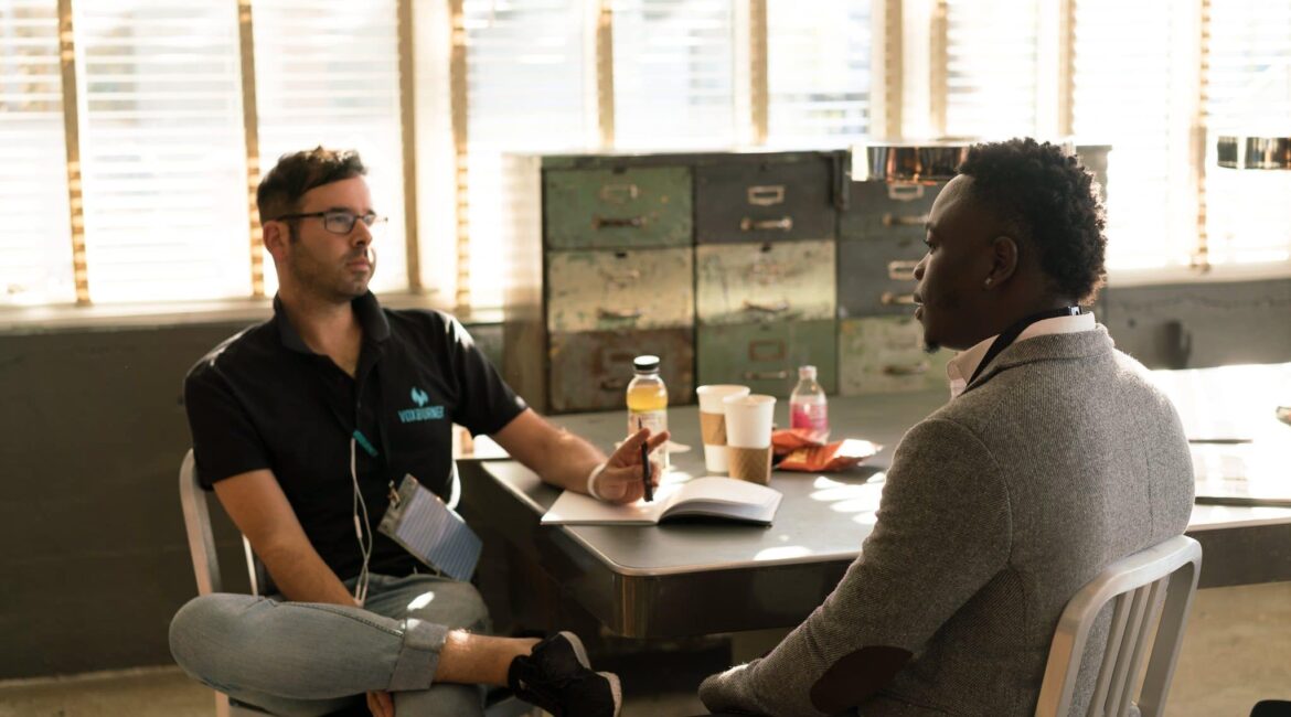 two people talking to prepare for a successful meeting